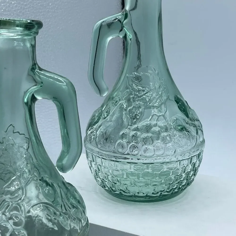 Vintage green cruets decanters embossed basket weave grapes.